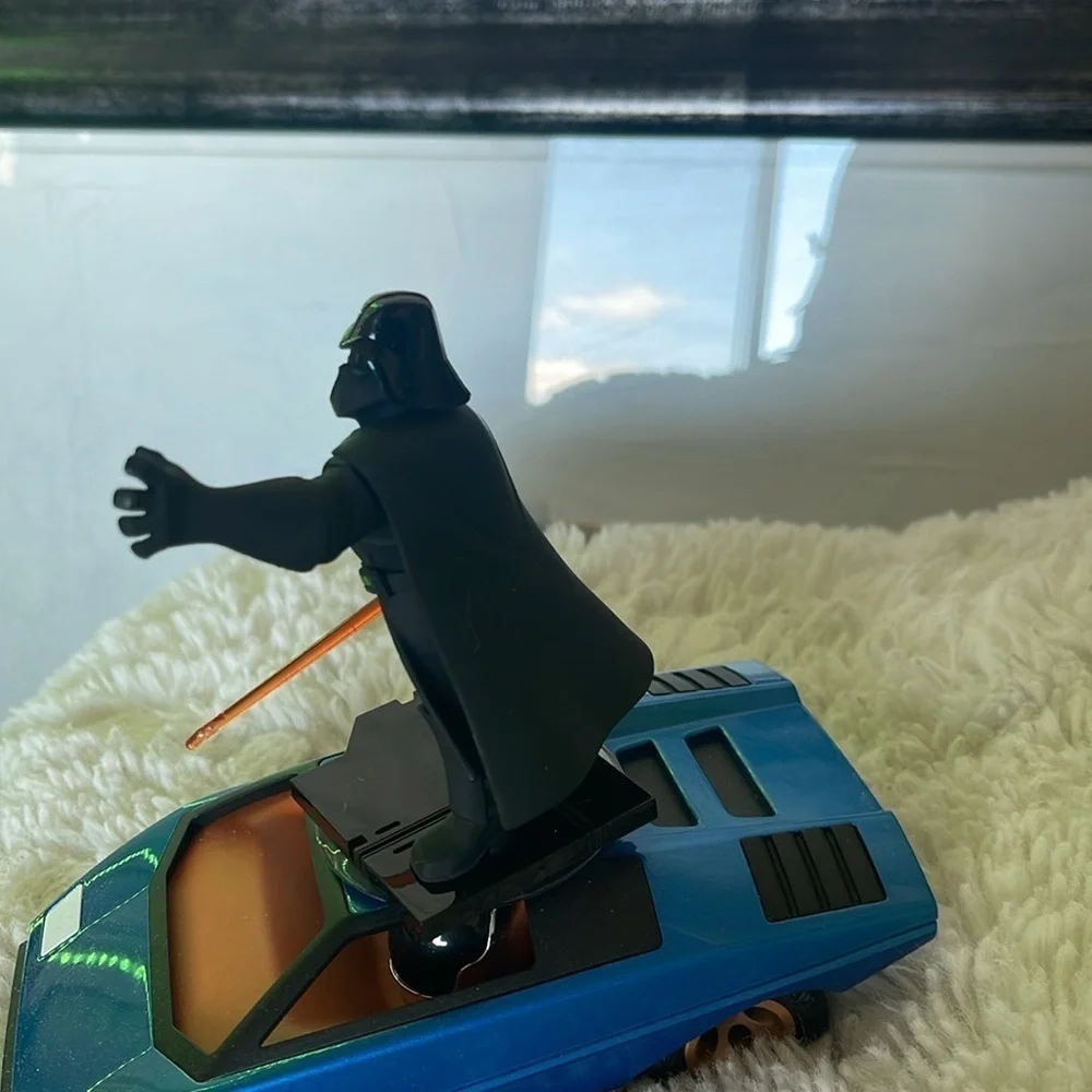 Darth Vader Figure on Blue Car